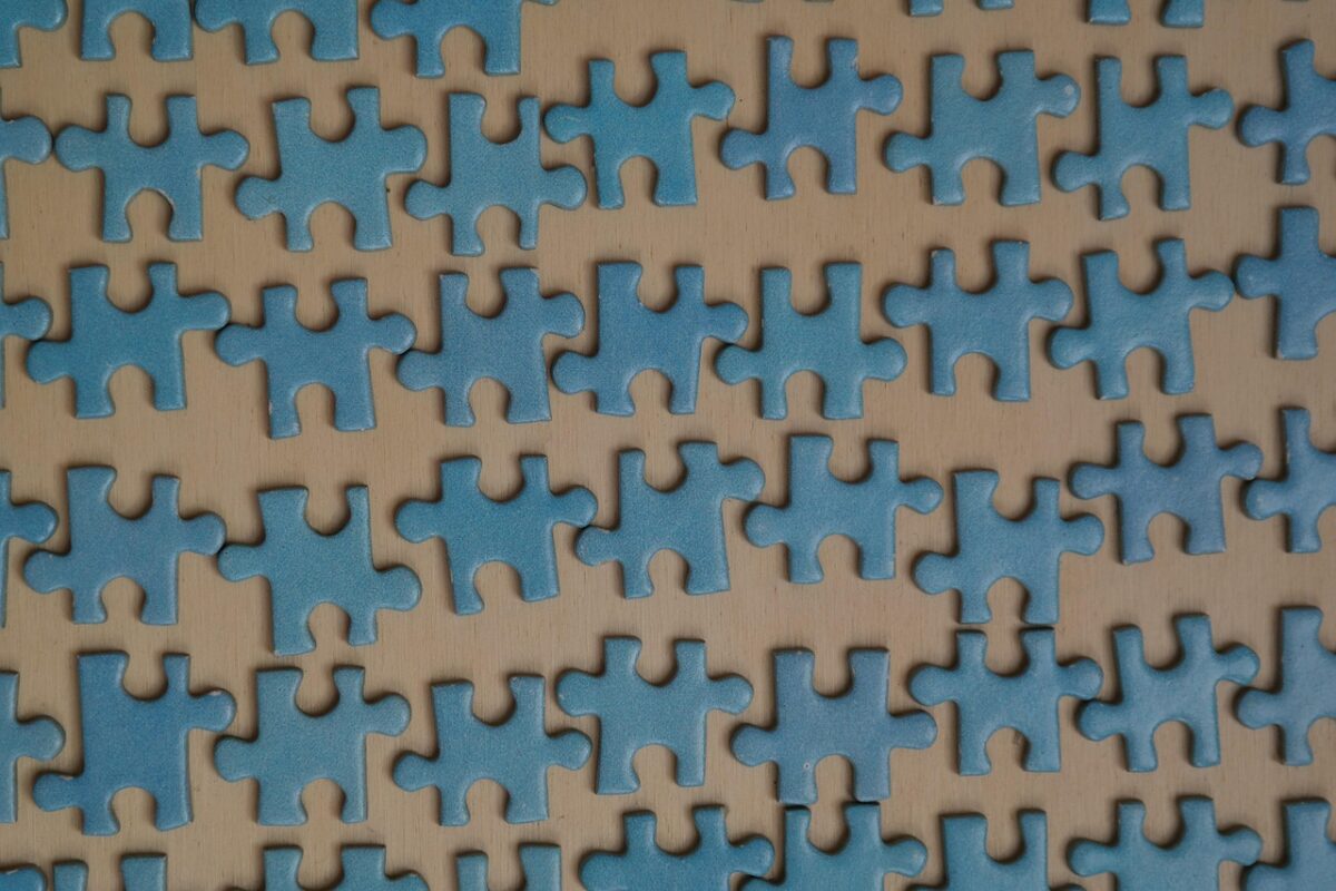 Puzzle pieces sorted into groups by colour