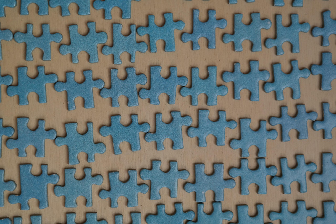 Puzzle pieces sorted into groups by colour